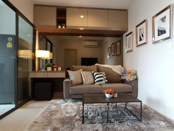 Modern living room with stylish decor and cozy seating area in a contemporary apartment.