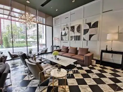 Luxurious modern living room with elegant decor and large windows offering garden views.