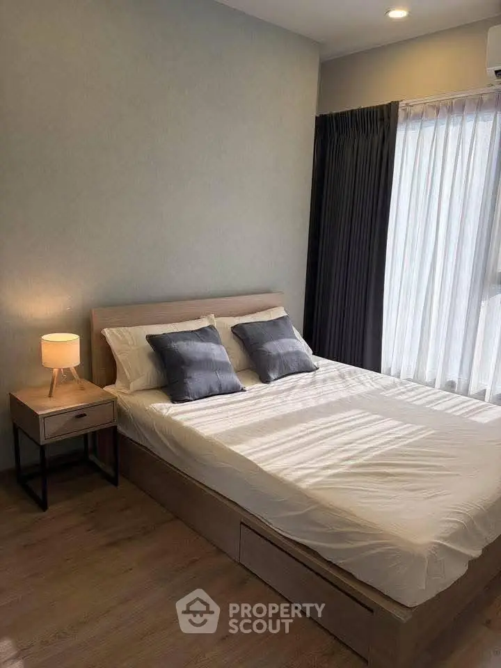 Cozy bedroom with modern decor and natural light