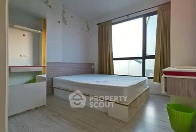Modern bedroom with large window and minimalist design, featuring a comfortable bed and ample natural light.
