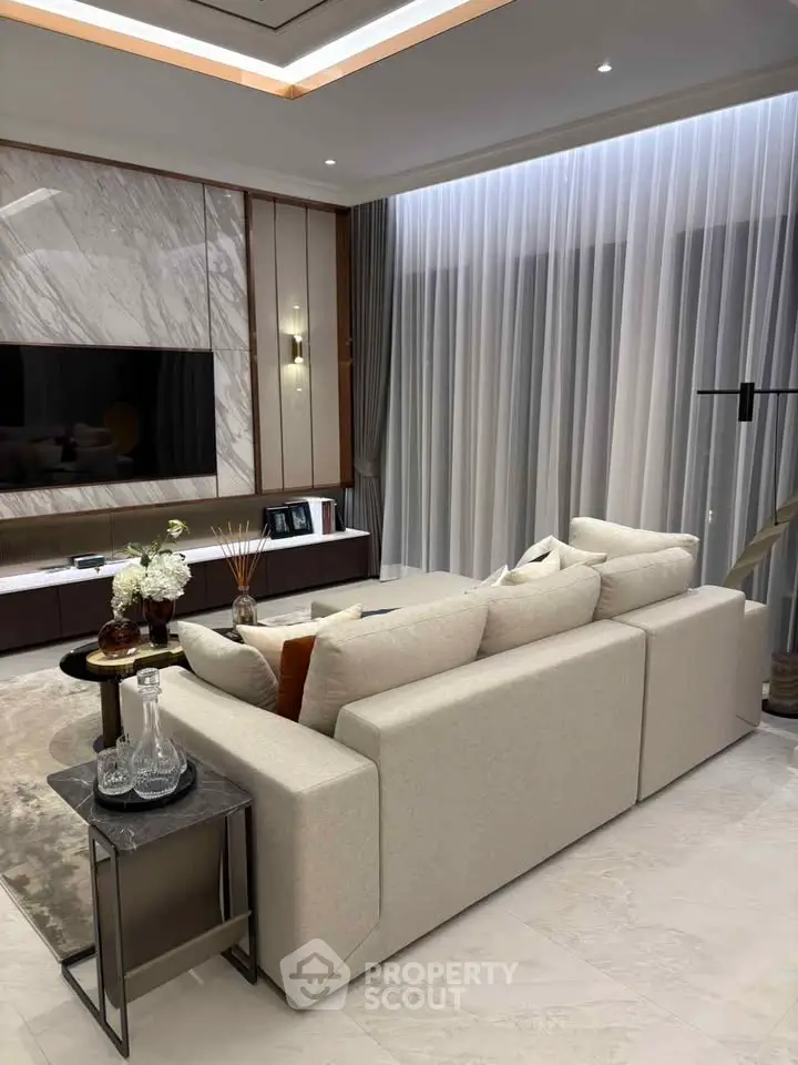 Luxurious living room with elegant decor and large windows