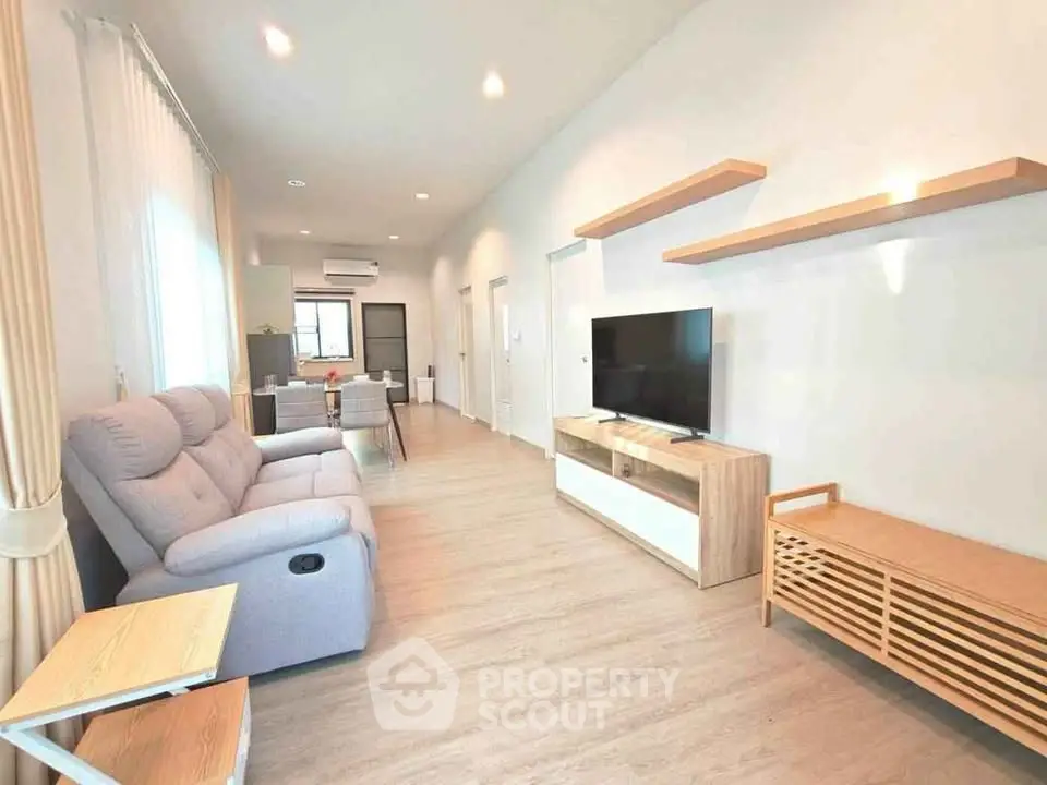 Spacious modern living room with sleek furniture and open layout