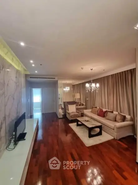 Luxurious living room with elegant decor and hardwood floors in modern apartment.