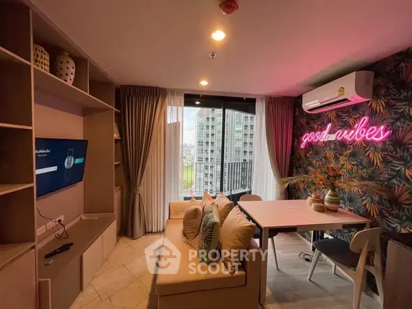 Stylish living room with neon sign and city view balcony, perfect for modern urban living.