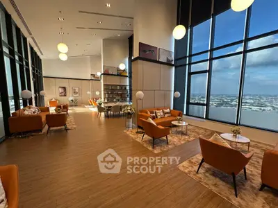 Luxurious high-rise living room with panoramic city views and elegant modern furnishings.