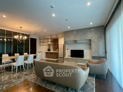 Luxurious open-plan living room with elegant dining area and modern kitchen in a high-end apartment.