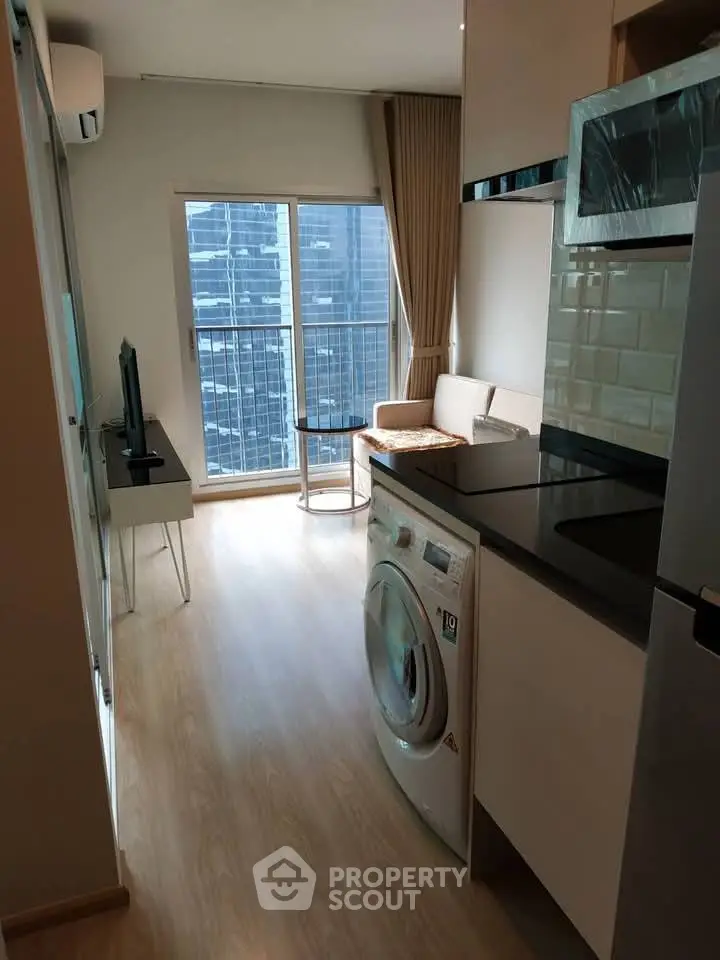 Modern apartment interior with washing machine and city view