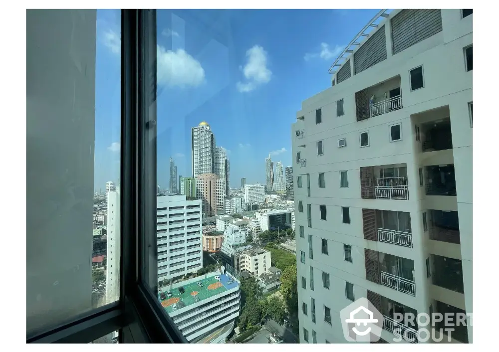 Stunning cityscape view from high-rise apartment window in urban setting