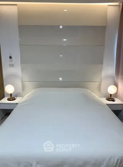 Modern bedroom with sleek design and ambient lighting