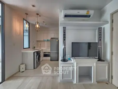 Modern apartment interior with sleek kitchen and entertainment area