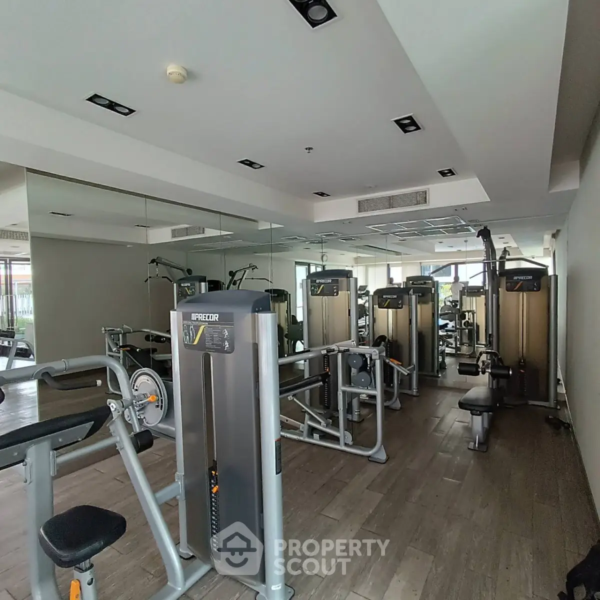 Modern gym with state-of-the-art fitness equipment in a residential building.