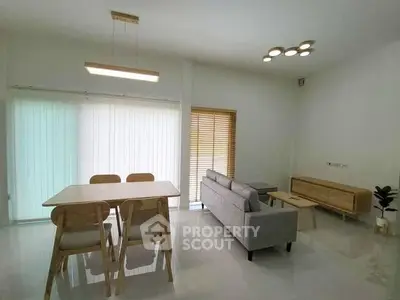 Modern minimalist living room with dining area and stylish furniture