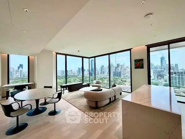 Luxurious high-rise living room with panoramic city views and modern furnishings.