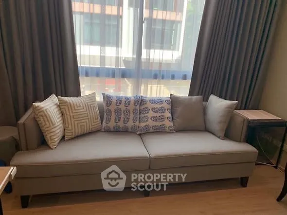 Stylish living room with modern sofa and elegant curtains