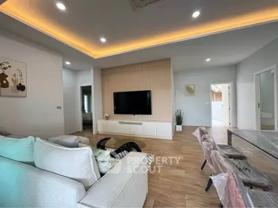 Spacious modern living room with elegant lighting and stylish decor
