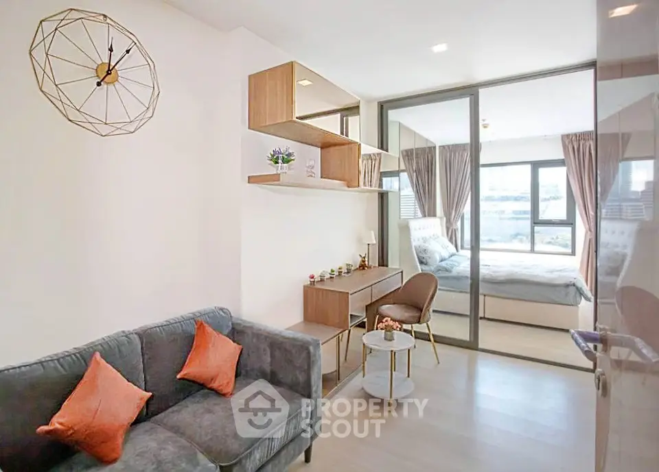 Modern living room with stylish decor and cozy bedroom view