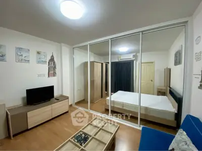 Modern bedroom with mirrored closet and stylish decor