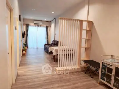 Spacious living room with modern decor and natural light