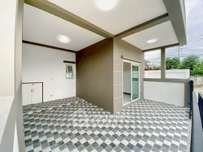 Modern outdoor patio with checkered tile flooring and sleek design