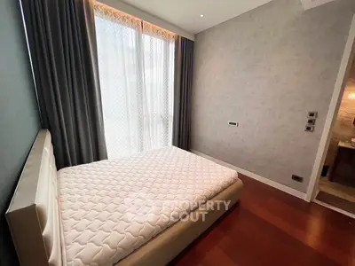 Modern bedroom with minimalist design and large window for natural light