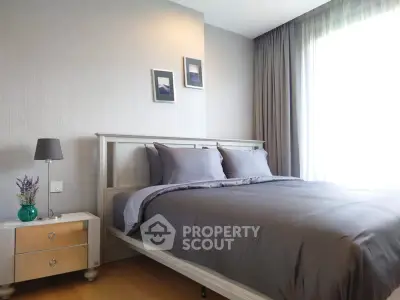 Elegant bedroom with modern decor and natural light