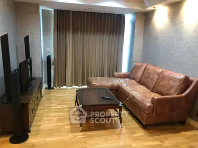 Cozy living room with leather sofa and modern entertainment setup