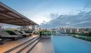 Luxurious rooftop pool with stunning city view and modern lounge area.