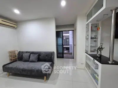Modern living room with sleek sofa and balcony view in stylish apartment