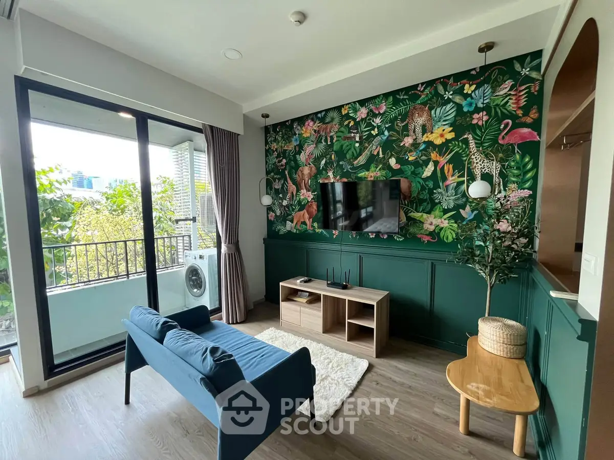 Stylish living room with vibrant jungle-themed wallpaper and balcony view