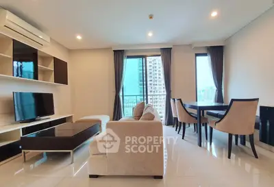 Spacious modern living room with elegant dining area and city view.