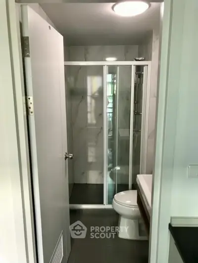 Modern bathroom with glass shower enclosure and sleek design