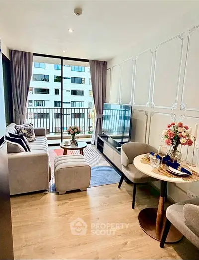 Modern living room with elegant decor and large windows in a stylish apartment