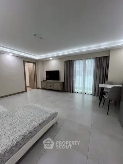 Spacious modern living room with sleek furniture and natural light