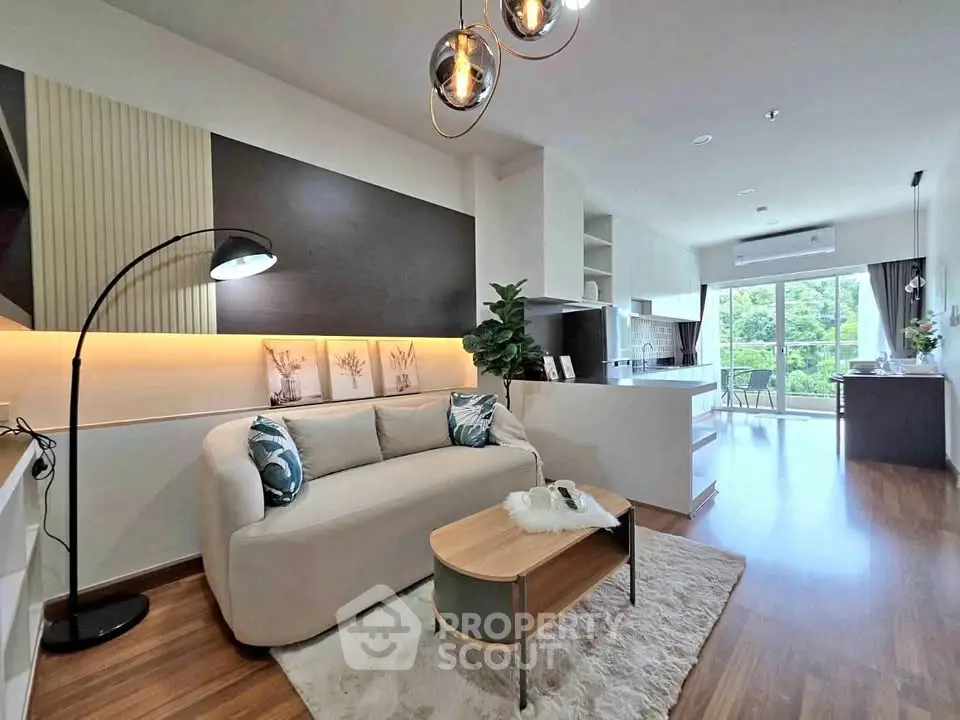 Modern open-layout living room with stylish decor and natural light