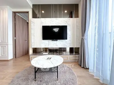 Luxurious living room with marble TV wall and elegant decor