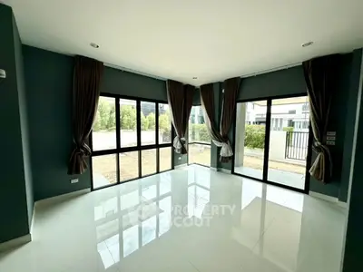 Spacious corner unit living room with large windows and natural light