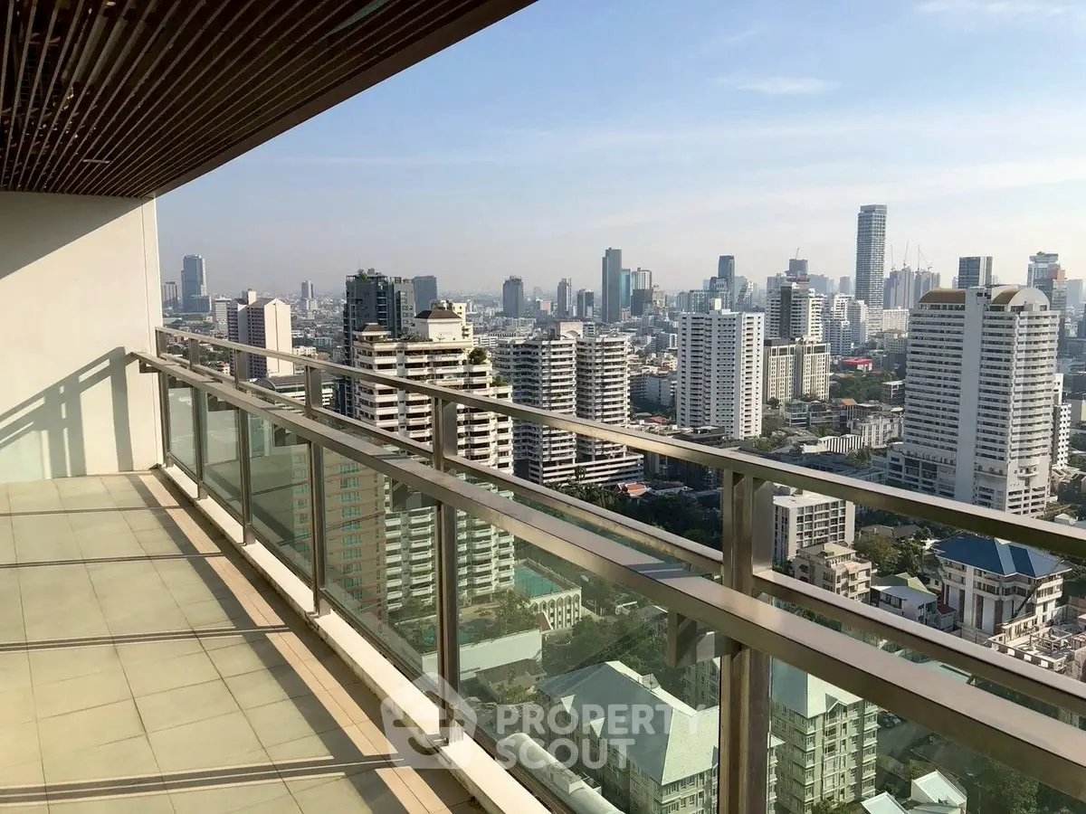 Stunning high-rise balcony with panoramic city skyline views, perfect for urban living enthusiasts.