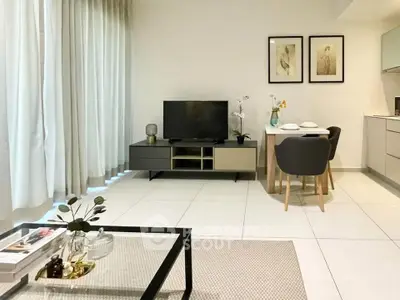 Modern living room with sleek furniture and dining area, perfect for urban living.