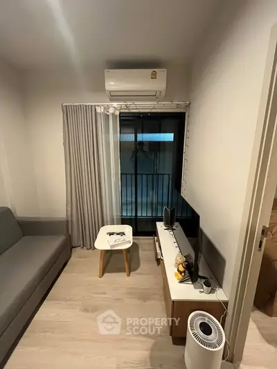 Cozy living room with modern decor and air conditioning