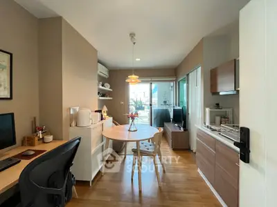 Charming open-layout living and dining area with modern decor and natural light.