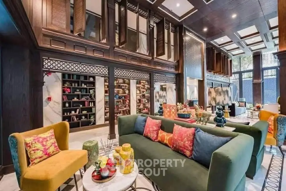 Luxurious living room with elegant decor and vibrant colors in a modern real estate property.