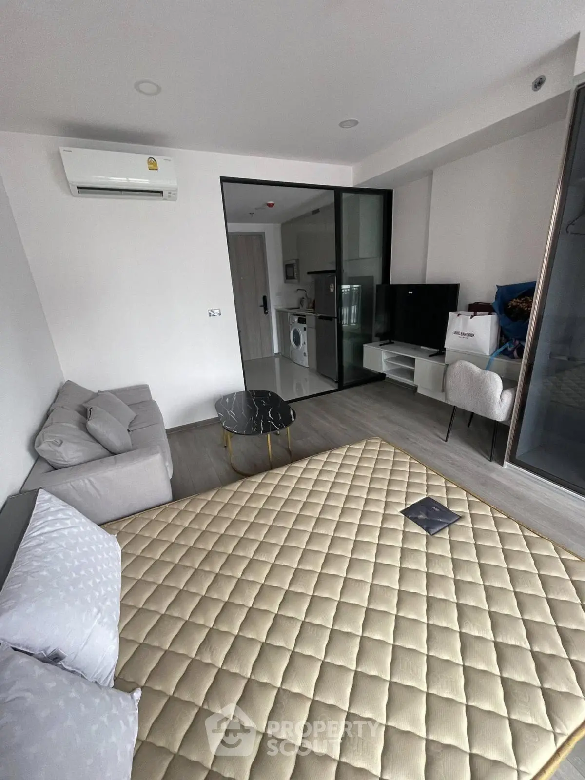 Modern studio apartment with cozy living area and kitchen