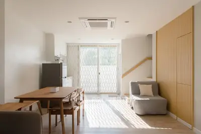 Bright and modern living room with dining area and stylish furniture