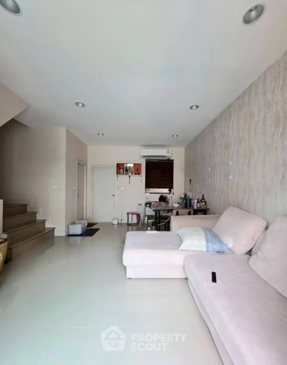 Spacious living room with modern decor and cozy seating area