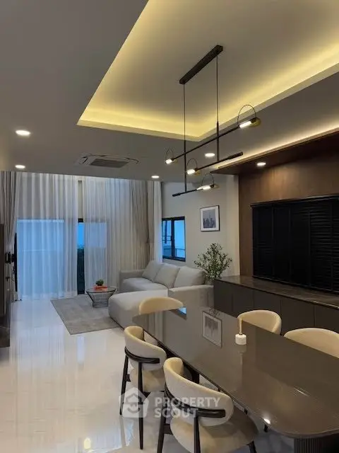 Luxurious modern living room with elegant dining area and ambient lighting.