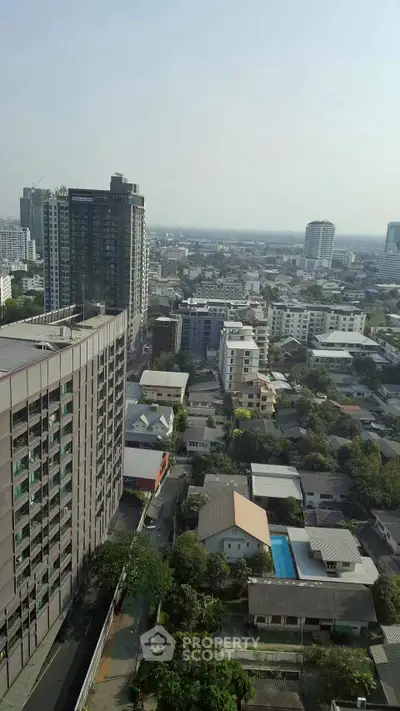 Stunning cityscape view from high-rise building showcasing urban living and skyline.