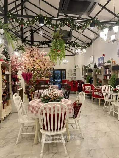Charming festive-themed dining area with elegant decor and cozy seating, perfect for holiday gatherings.