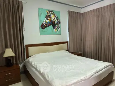 Cozy bedroom with colorful zebra artwork and elegant curtains