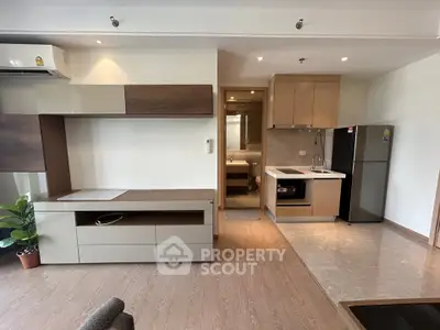 Modern open-plan living room with sleek kitchen and stylish decor