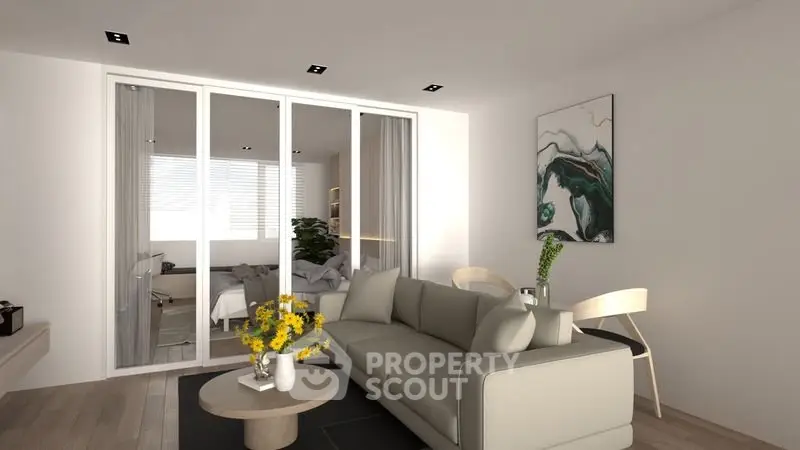 Modern living room with stylish decor and sliding glass doors leading to a cozy bedroom.